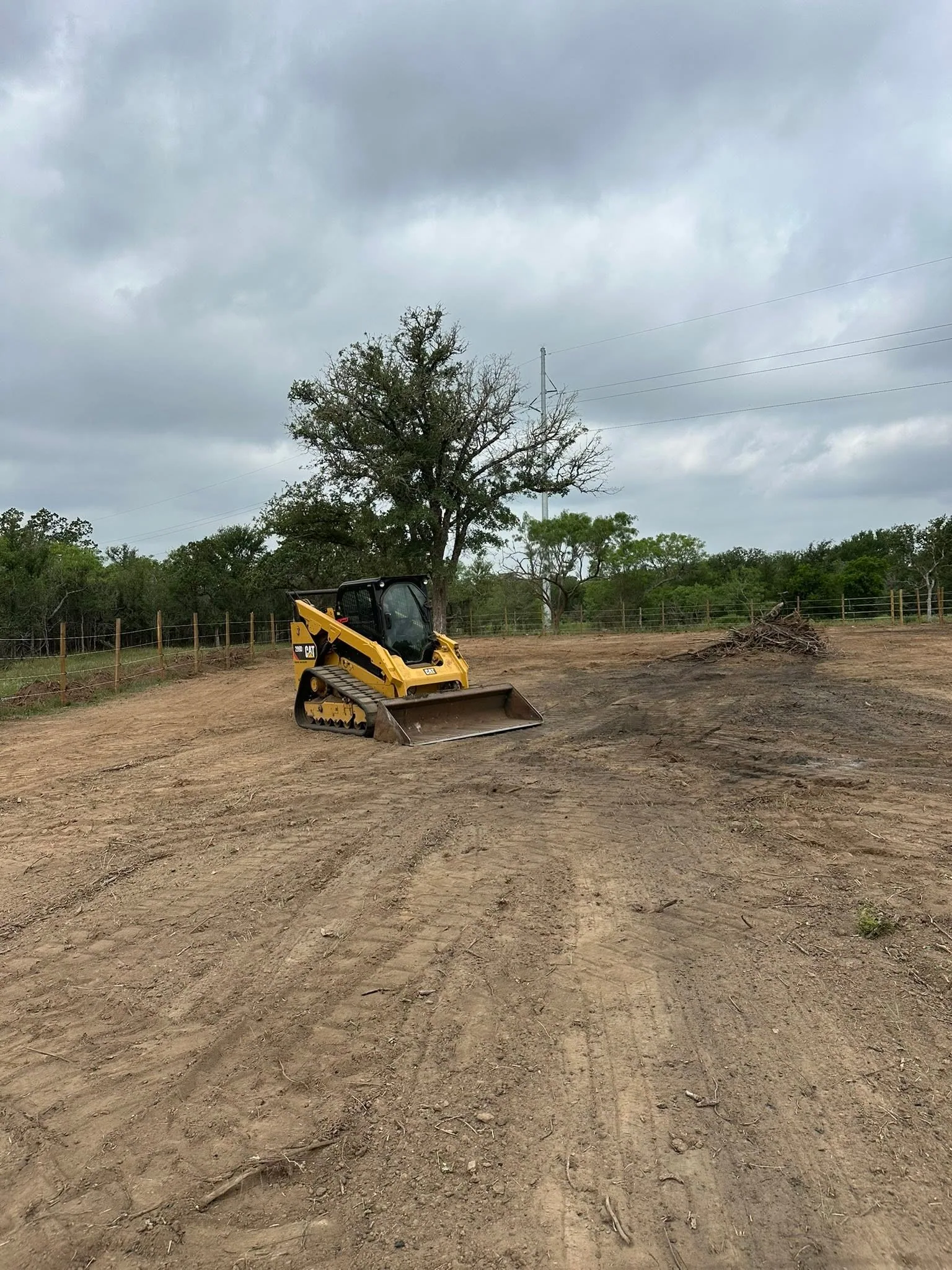 Cleared lot track loader brush pile site preparation