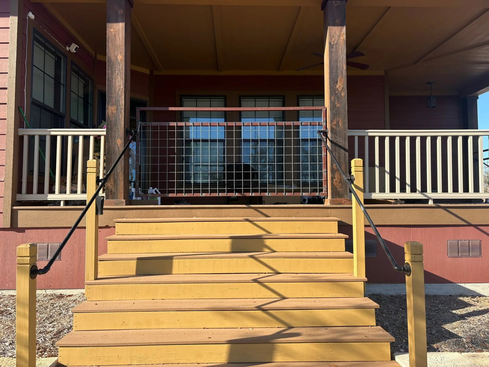 Front porch steps welded wire panel black pipe handrails