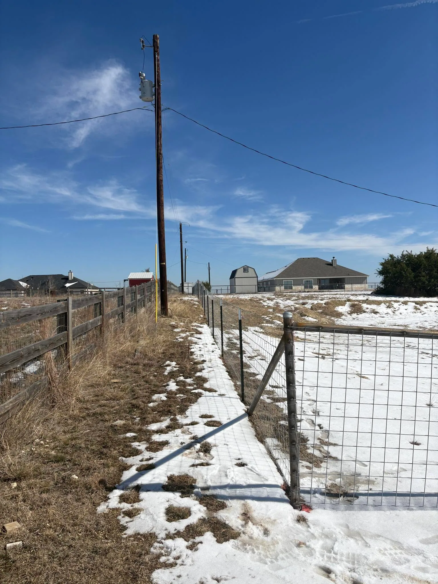 Snowy welded wire panel fence corner brace rural lot central texas